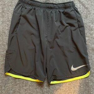 Nike Charcoal Athletic Shorts with Neon Trim and Elastic Waistband